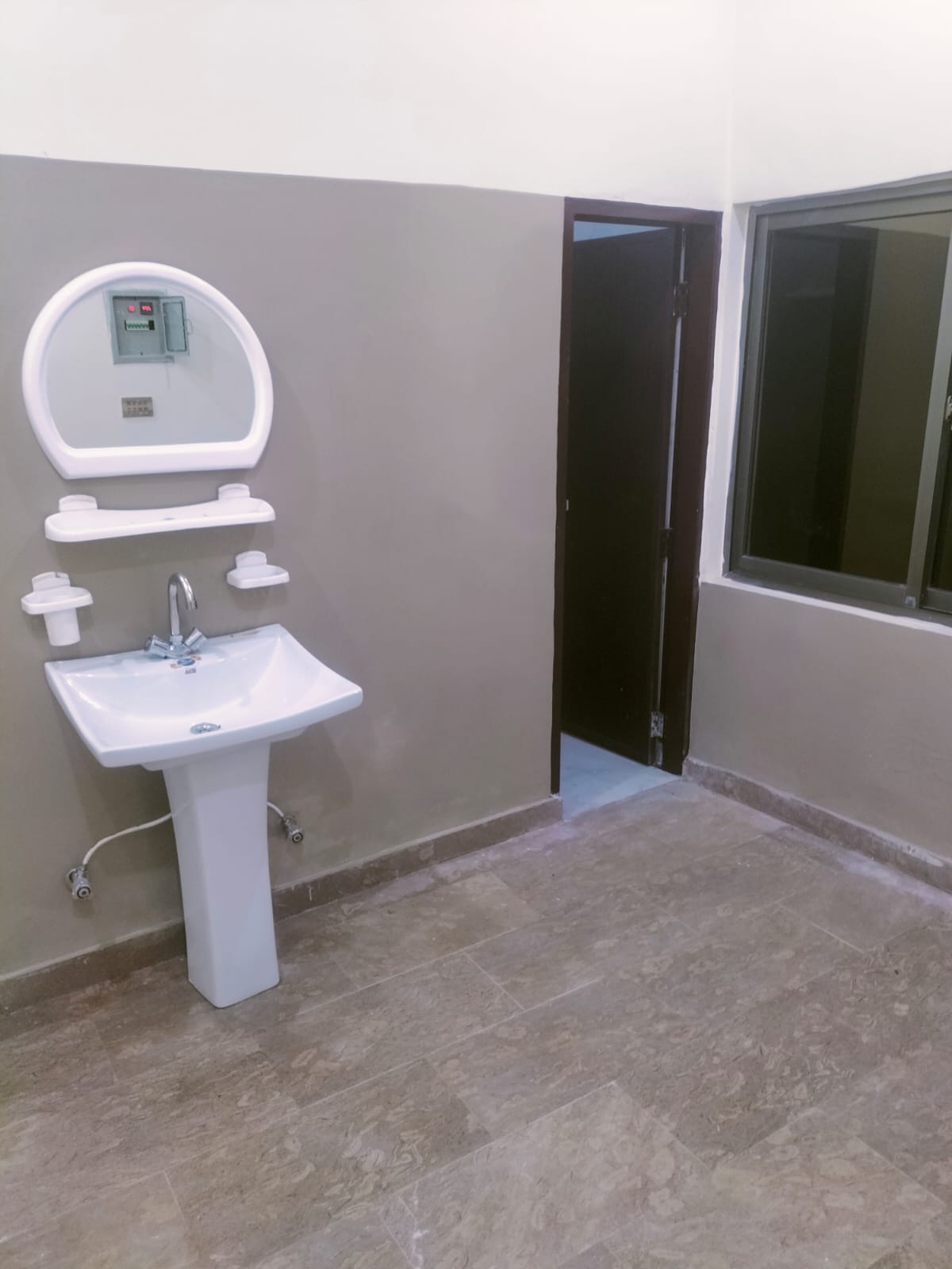 Ceramic Pedestal Washbasin with Vanity Mirror at The Second Home Boys Hostel Lahore