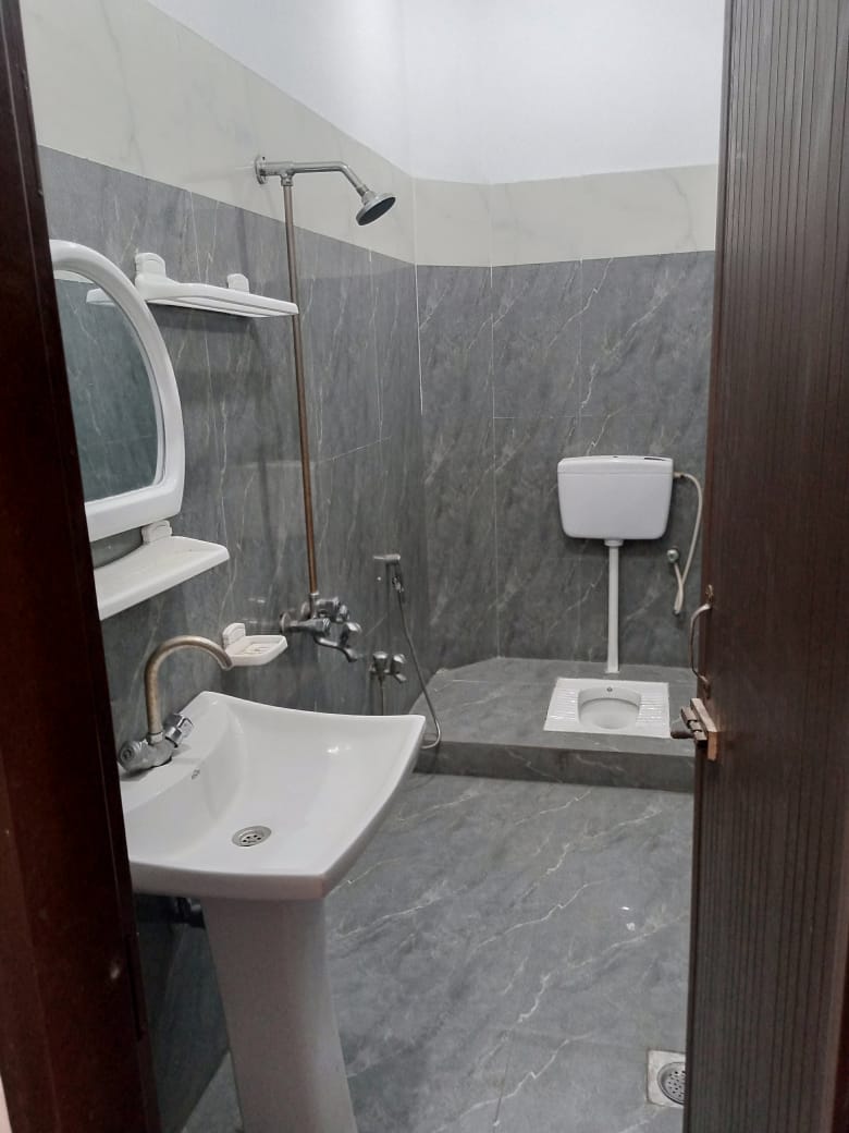 Clean Tiled Bathrooms & Washbasins at The Second Home Boys Hostel Lahore